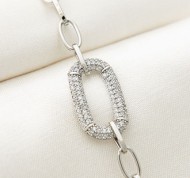 Bracciale in metallo con cristalli bianchi a forma geometrica